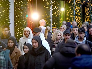 Crowds of shoppers walk past Selfridges in London's Oxford Street in December 2023