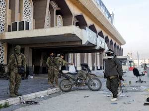 Syrian opposition fighters outside Aleppo International Airport