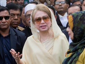 Bangladesh’s former prime minister Khaleda Zia surrounded by people