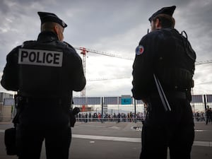 Police officers stand guard near the Stade de France