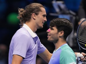 Alexander Zverev, left, embraces Carlos Alcaraz at the net