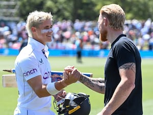 Jacob Bethell shakes hands with Ben Stokes