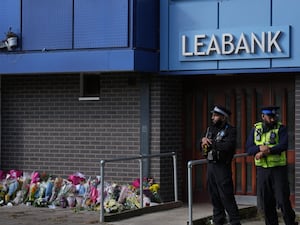 Police officers at Leabank in Luton, Bedfordshire where the family was killed