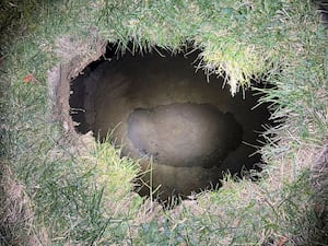 The top of a sinkhole in the village of Marguerite, Pennsylvania., where rescuers were searching for a woman who disappeared