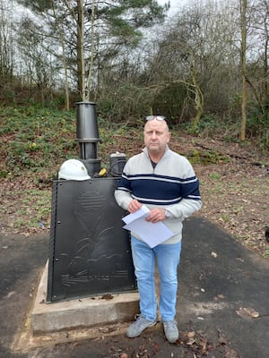 Alan Gaut next to a mining memorial in St George's, Telford. Photo: LDRS