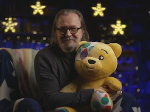 Gary Oldman hugging Pudsey bear