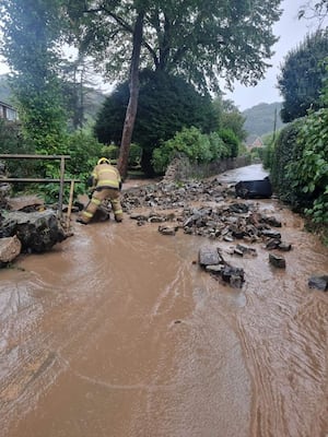 A wall collapsed in All Stretton in the floods in September. Photo: Shropshire Fire and Rescue Service