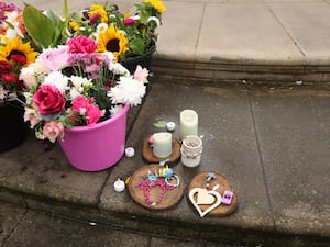 Flowers and tributes outside the Atkinson Art Centre Southport for the three girls