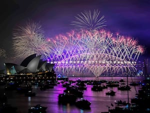 Fireworks explode over the Sydney Opera House and Harbour Bridge during New Year’s Eve celebrations in Sydney