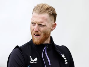 Ben Stokes looks across his right shoulder during an England training session.