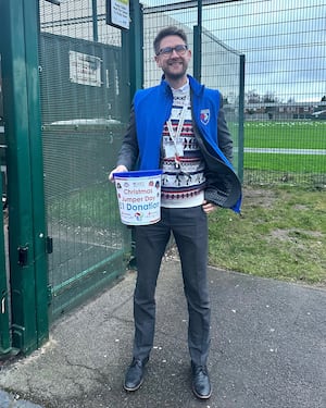 Dan Boden collecting donations for Christmas Jumper Day