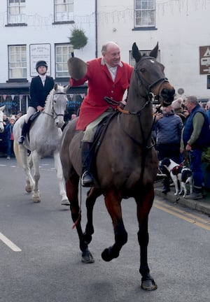 Robert Jones, senior joint master of the Radnor and West Herefordshire Hunt acknowledges the crowds as he rode off to follow the false trail.