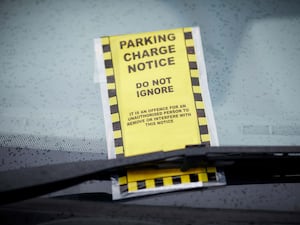 A parking ticket on a windscreen