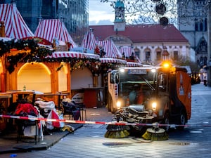 Clean-up truck operating in a Christmas market