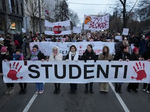 Student protesters in Belgrade holding banners