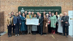 RWAS Feature County 2024 President, Mr Denley Jenkins and Ambassador, Mrs Esyllt Ellis Griffiths, along with the Ceredigion Committee members presenting the cheque for £430,000 to RWAS Chair of Board, Prof. Wynne Jones and Chair of Council, Mrs Nicola Davies at the recent RWAS Council Meeting.