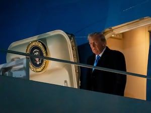 Donald Trump disembarks from Air Force One