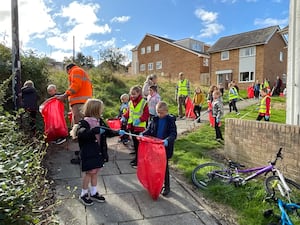 A community clean-up on the Treowen housing estate in Newtown which was organised as part of Caru Powys and included children from Treowen Primary School.