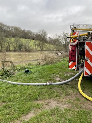 Water being pumped from the River Severn to deal with the fire.