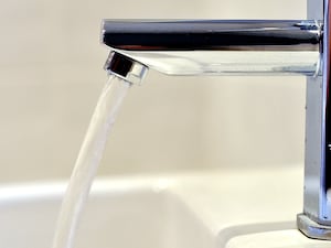 Water flowing from a tap