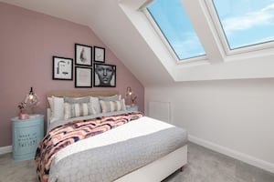 B&DWM - A bedroom in the Greenwood show home at Raine Place