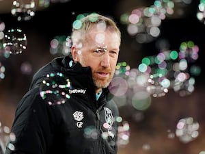 Bubbles surround Graham Potter on the touchline