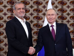 Iranian and Russian leaders shake hands