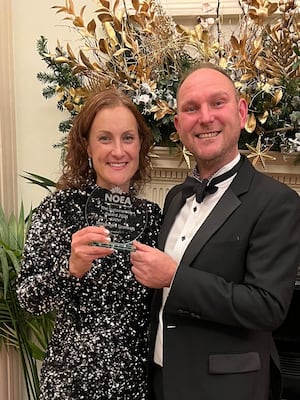 Beth and Sid Heath with the award