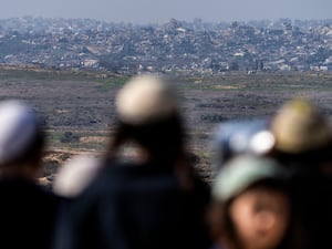 People watch the Gaza Strip from an observation point in Sderot, southern Israel