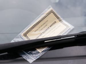 A parking ticket on a windscreen