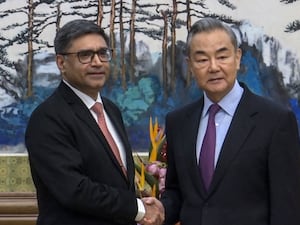 Chinese Foreign Minister Wang Yi, right, meets with India’s Foreign Secretary Vikram Misri