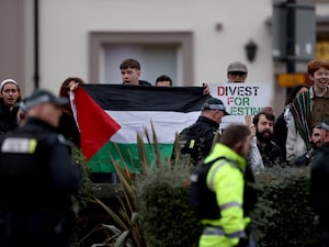 A protest outside Queen’s University during a visit by Hillary Clinton