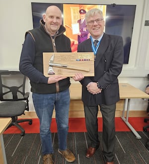 John Deakin is the longest-serving firefighter in Ellesmere's history, pictured here with Shropshire High Sheriff, Brian Welti JP. Photo: Ellesmere Fire Station