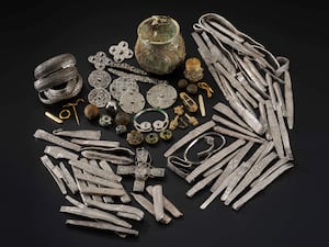 Items from the Galloway Hoard spread on a black table top