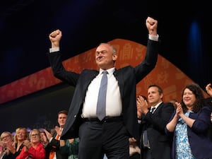 Liberal Democrat leader Sir Ed Davey arriving on stage to give his keynote speech at the party’s autumn conference at the Brighton Centre in Brighton