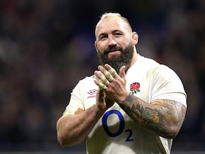 A smiling Joe Marler claps after playing a game for England