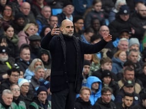 Manchester City manager Pep Guardiola gestures on the toucline