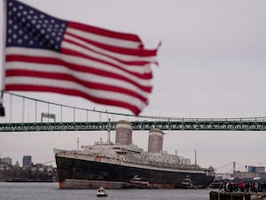 The SS United States being towed down the Delaware River