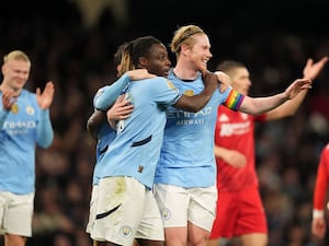 Kevin De Bruyne celebrates with Jeremy Doku