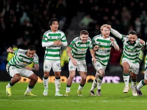 Celtic players celebrate their Premier Sports Cup victory