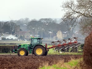 Tractor ploughing a field