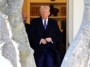 President Donald Trump walks from the Oval Office to depart on Marine One from the South Lawn of the White House in Washington