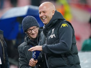 Manager Arne Slot smiles after Liverpool's win over Lille