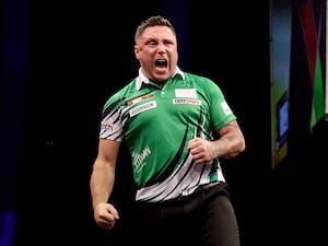 Gerwyn Price, pictured, reacts during his match against Luke Littler in the Premier League in Dublin