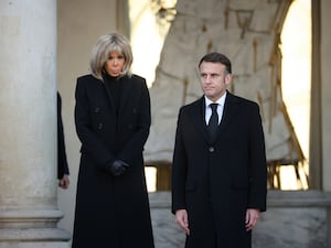 French President Emmanuel Macron and his wife Brigitte Macron mark the minute's silence