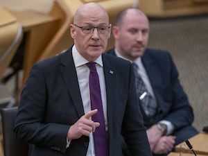 John Swinney speaking in Holyrood