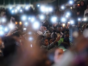 Phone lights held up amid Elianne Andam vigil