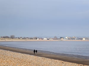 Dungeness beach with houses in the background