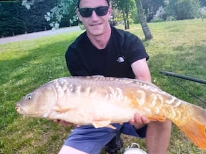 Louis Price holding a fish