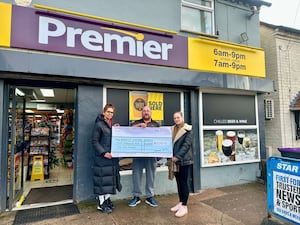 Tina (left), Chloe and Ian with the cheque